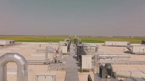 Industrial rooftop hvac system and ventilation pipes at factory with rural .. Stock Footage 337524727