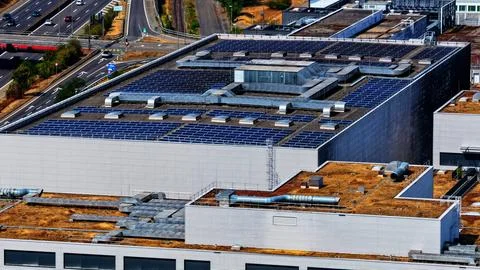 Industrial Rooftop Solar Array with Ventilation Infrastructure Photos