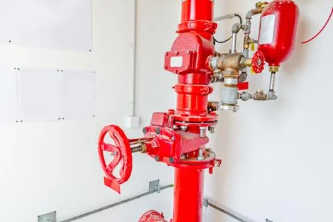 Industrial safety fire control system, red water pipes with valve Stock Photos