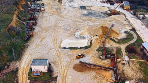 Industrial sand mining facility with conveyor belts and loader aerial view Stock Footage 329933935