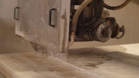 Industrial saw  sawing huge  block of marble Stock Footage 76877853