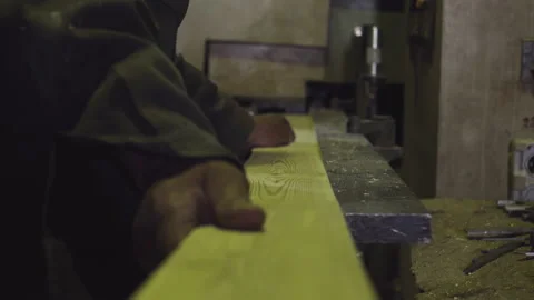 Industrial Sawing Machine is processing multiple wooden boards at the factory Stock Footage 169580177