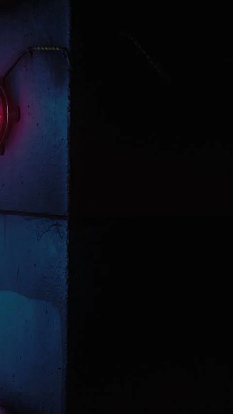 Industrial scene showing dark elements and red light in a workshop area Stock Footage 338413960