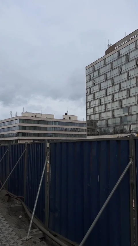 Industrial scenery featuring reflective windows and fencing elements Stock Footage 347331902