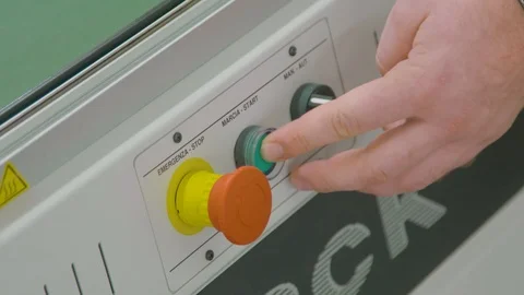 Industrial setup. Close up of factory worker pushing a button on a machinery Stock Footage 86798660