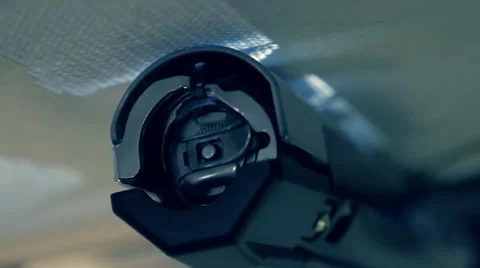 Industrial sewing machine embroiders on program, pattern of white thread on blue Stock Footage 68368851