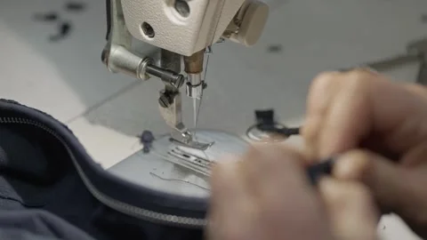 Industrial sewing machine needle stitching fabric seam Stock Footage 331983085