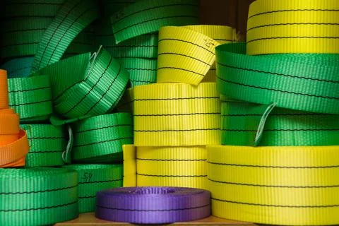 Industrial sewing machine sews a webbing sling. Manufacture of textile slings Stock Photos