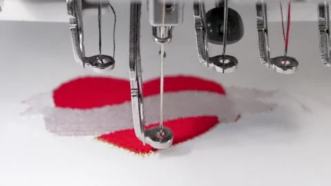 Industrial Sewing Machine stitching love heart in macro Close up Stock Footage 247122145