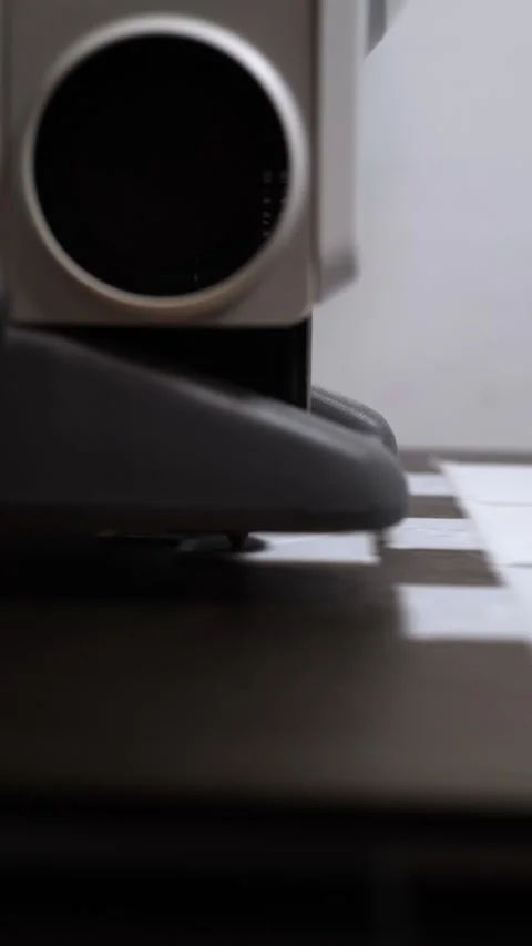 Industrial sewing machine working on white fabric in a textile workshop Stock Footage 342521211