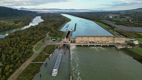 Industrial ship passing through the lock above the hydroelectric power plant. Stock Footage 290816677