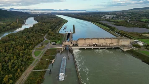 Industrial ship passing through the lock above the hydroelectric power plant. Stock Footage 290816737