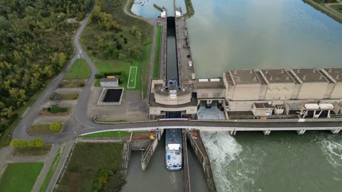 Industrial ship passing through the lock above the hydroelectric power plant. Stock Footage 290816840