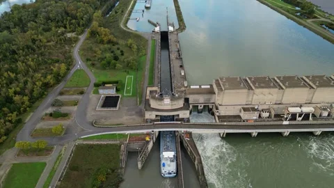 Industrial ship passing through the lock above the hydroelectric power plant. Stock Footage 290817270