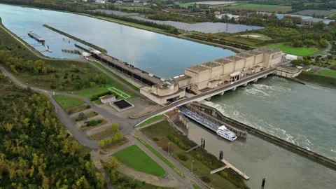 Industrial ship passing through the lock above the hydroelectric power plant. Stock Footage 290817292