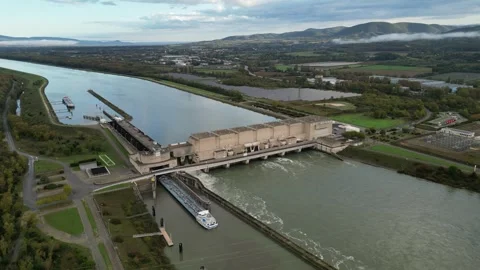 Industrial ship passing through the lock above the hydroelectric power plant. Stock Footage 290817309