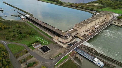 Industrial ship passing through the lock above the hydroelectric power plant. Stock Footage 290817439