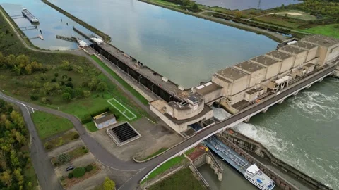 Industrial ship passing through the lock above the hydroelectric power plant. Stock Footage 290817658