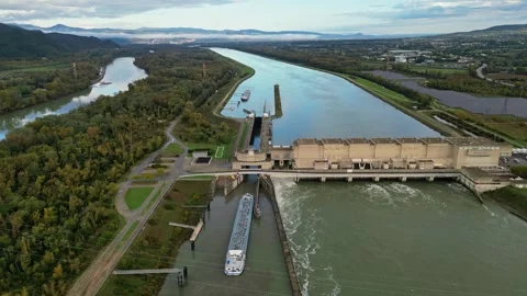 Industrial ship passing through the lock above the hydroelectric power plant. Stock Footage 290817660