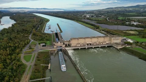 Industrial ship passing through the lock above the hydroelectric power plant. Stock Footage 290840690