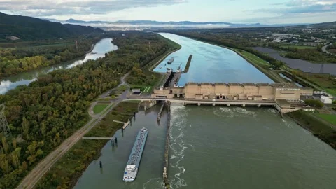 Industrial ship passing through the lock above the hydroelectric power plant. Stock Footage 290840832