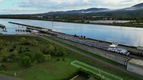 Industrial ship passing through the lock above the hydroelectric power plant. Stock Footage 290840836