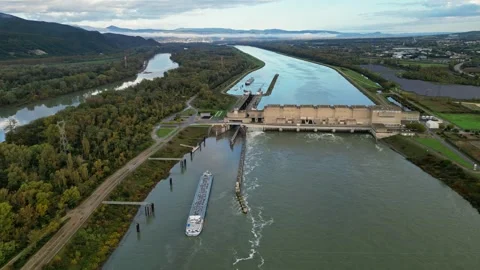 Industrial ship passing through the lock above the hydroelectric power plant. Stock Footage 290840927