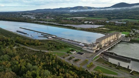 Industrial ship passing through the lock above the hydroelectric power plant Stock Footage 291934862