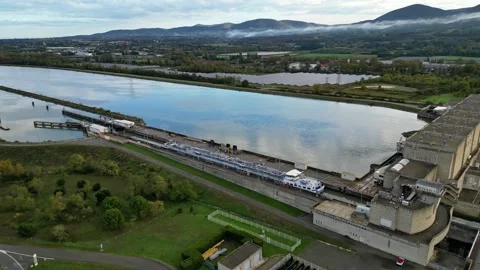 Industrial ship passing through the lock above the hydroelectric power plant Stock Footage 291935112