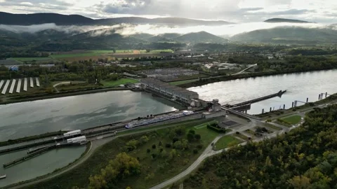 Industrial ship passing through the lock above the hydroelectric power plant Stock Footage 291935159