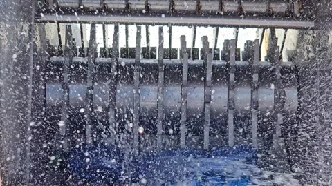 Industrial Shredder Machine Crushing Plastic Bottles for Recycling Close Up Stock Footage 335839454
