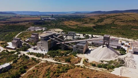 Industrial site featuring processing buildings and raw materials Stock Footage 341327476