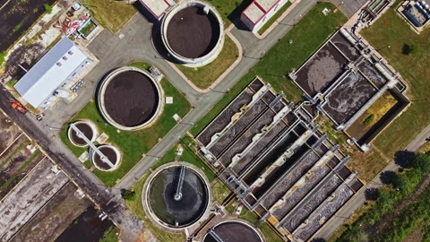 Industrial site with water facilities. Drones capture sewage processing complex Stock Footage 339494394