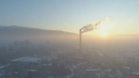 Industrial smoke from chimneys at sunset in Sofia, Bulgaria Stock Footage 144627761