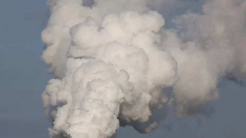 Industrial smoke stack against Stock Footage 77554236
