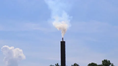 Industrial smoke stack on a blue sky with light clouds Stock Footage 134361327