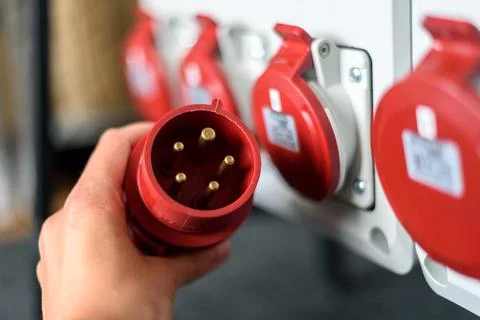 Industrial sockets and plug on distribution board Stock Photos