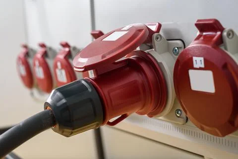 Industrial sockets and plug on distribution board Stock Photos