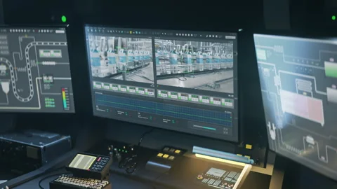 Industrial software displays the production process on the computer monitors Stock Footage 259186311