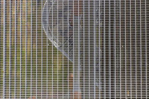 Industrial steel mesh grill with rectangular grid pattern Stock Photos