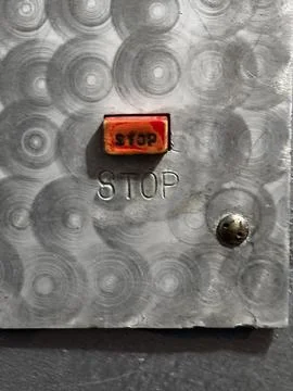 Industrial Stop Button on Metal Panel for Safety Applications Stock Photos