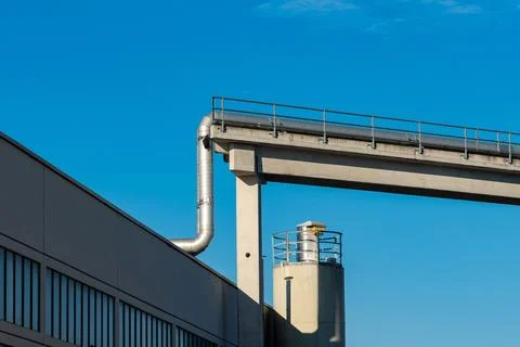 Industrial structure under clear blue sky in urban area Stock Photos