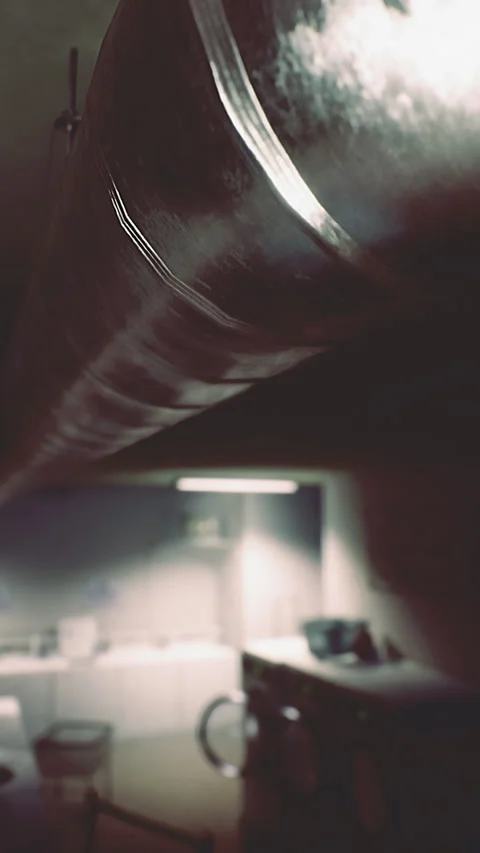 Industrial style kitchen interior features metal ventilation ducting Stock Footage 317961135
