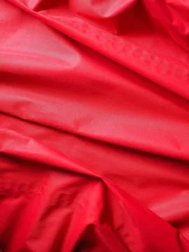 Industrial style rippled red polyester fabric texture background Stock Illustration