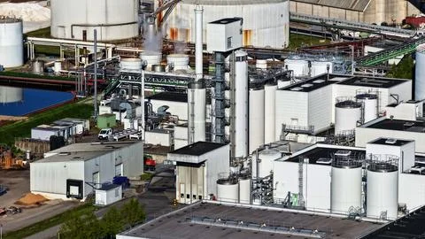 Industrial Sugar Processing Facility with Tanks, Pipelines and Energy Systems Stock Photos