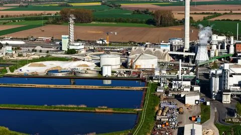 Industrial Sugar Processing Facility with Tanks, Pipelines and Energy Systems Stock Photos