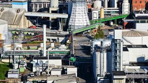 Industrial Sugar Processing Facility with Tanks, Pipelines and Energy Systems Stock Photos