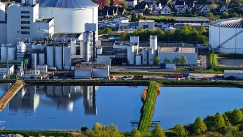 Industrial Sugar Processing Facility with Tanks, Pipelines and Energy Systems Stock Photos