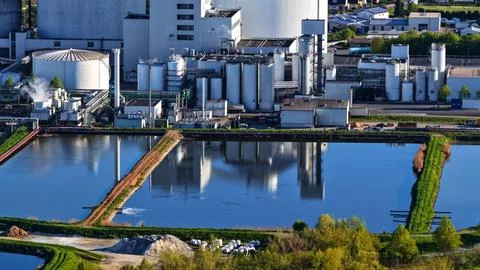 Industrial Sugar Processing Facility with Tanks, Pipelines and Energy Systems Stock Photos