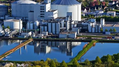 Industrial Sugar Processing Facility with Tanks, Pipelines and Energy Systems Stock Photos